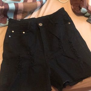 Distressed black jean shorts